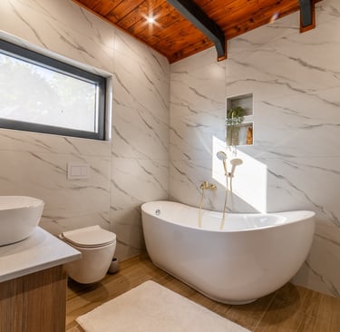 a bathroom with a tub tub and a wooden ceiling
