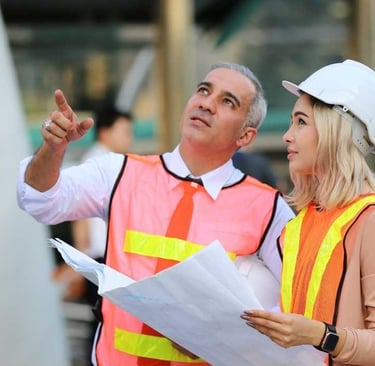 a man and woman in safety vests and safety vests