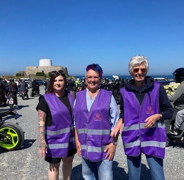 GSAG members standing in front of a group of motorcycles