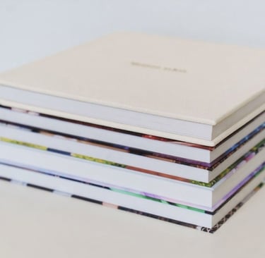 a stack of books with a white cover and a white book