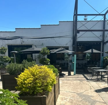 patio of neuse river brewing