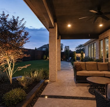 Warm low-voltage outdoor lighting along a North Texas patio and stone walkway