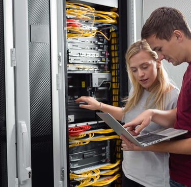 Network engineers, working on the cabinet