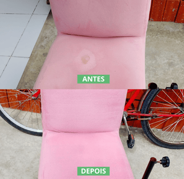 a pink chair with a bicycle in the background