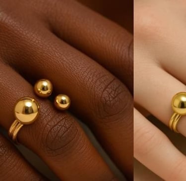 a woman's handmade ring with a gold ball