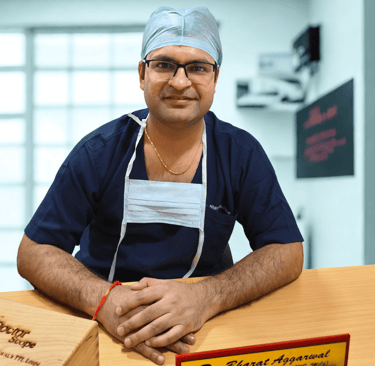 "Dr Bharat Agarwal consulting patient at plastic, reconstructive and cosmetic surgery clinic in Udaipur"