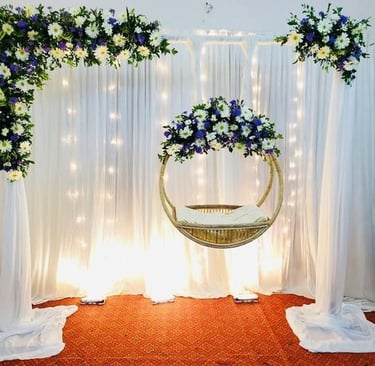 a hanging chair with flowers in a room