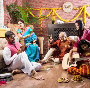 a group of people sitting on a couch playing guitar