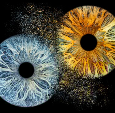 a close up of a pair of eyes with a black background
