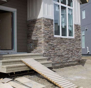 custom stone masonry installation on front of house