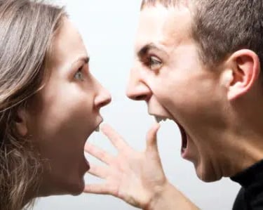 a man and woman are looking at each other