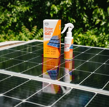 a nanocoating product in a yellow and white spray bottle and box set on top of a solar panel