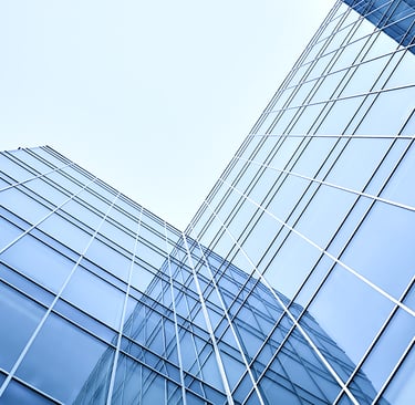 upward angle of an L shaped glass window building