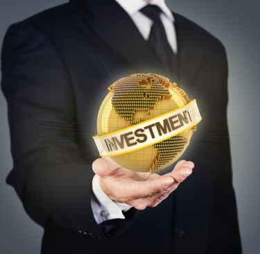 'investment', text by a sturdy man holding the globe, showing scope across it for customers