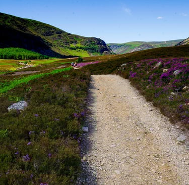 Trail with trekkers at Glen Mark Cairngorms Scotland