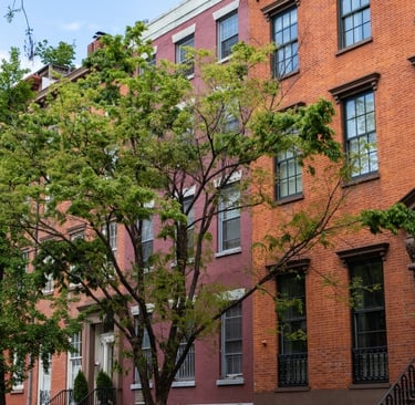 Row of Old Colorful Brick Residential Buildings along a Street in Chelsea of New York City