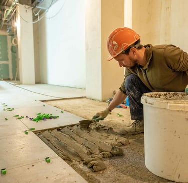 this image displays a man installing tiles and saving the labor cost.