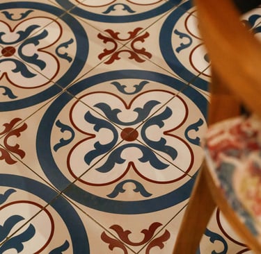 this image has hand painted tile in patio