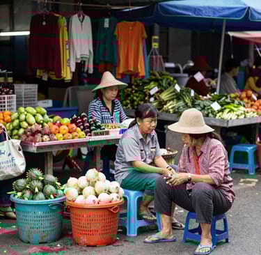 Satisfied customer smiling while holding car keys in front of a Mazda showroom.