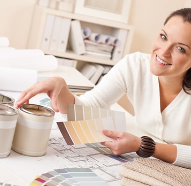 happy woman holding swatches of colors
