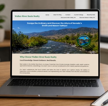 Laptop displaying the Walker River Basin Realty website featuring scenic Nevada valley real estate listings.