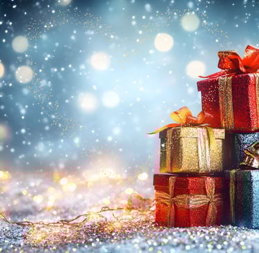 a pile of presents with a christmas tree