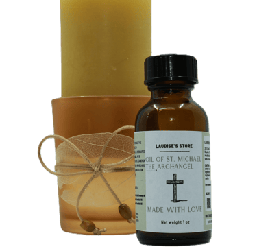 A 1-oz bottle of oil of St Michael the Archangel standing next to a beeswax candle