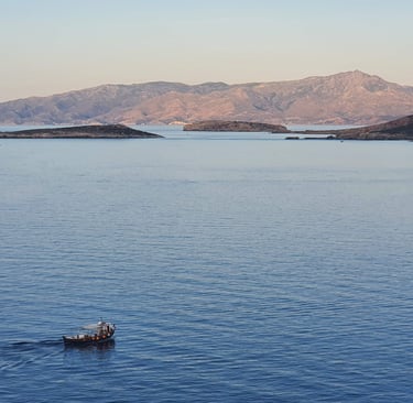 seascape of small islands and a fishing boat
