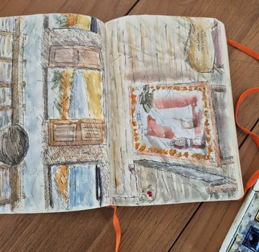 a travelling journal with watercolor skeches