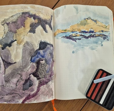  a traveling sketchbook with watercolor paintings