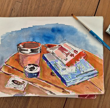 watercolor drawing of a cup of coffee and paing matterials