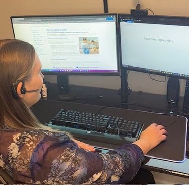 Patient Advocate hard at work on calls, reviewing case notes, and claims information.