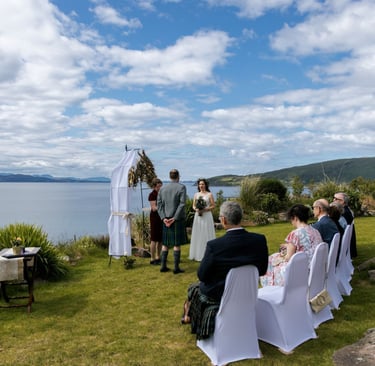 a wedding ceremony on the coast with a view of the water