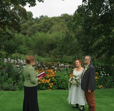 a man and woman getting married in a garden