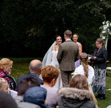 a man and woman getting married in a wedding ceremony