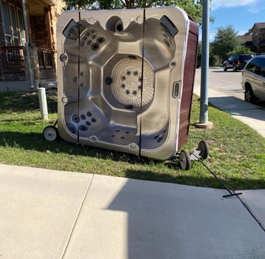 Swift Movers preparing to move a hot tub with specialized equipment for heavy and awkward items