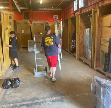 Swift Movers white glove crew in warehouse, trained and ready for high-value deliveries