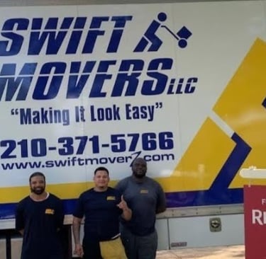 Three Swift Movers standing in front of moving truck, ready to assist with partial packing services