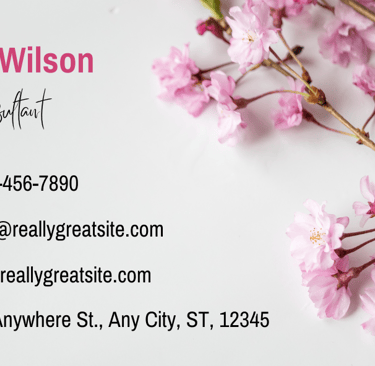 a business card with a pink flower on it