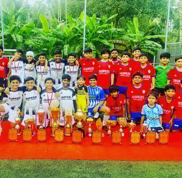 Football coaching camp kids with the trophies they won
