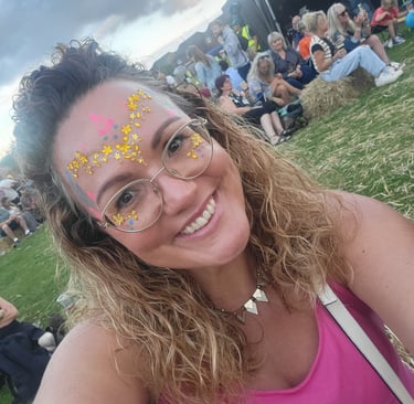 Pretty girl in festival glitter enjoying the music and atmosphere