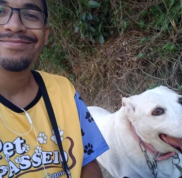 a man with a dog on a leash and a dog