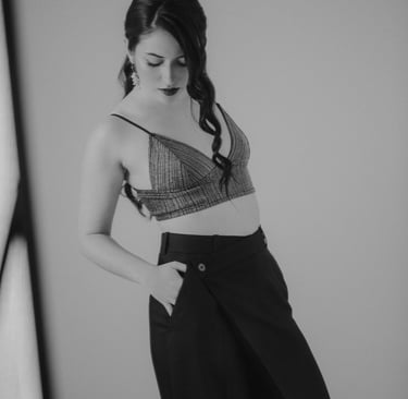 a woman in a bra top and skirted skirt