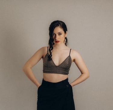 a woman in a bra top and skirt