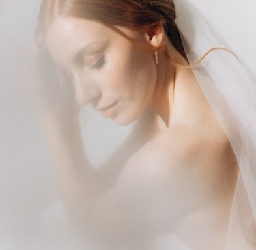 a woman in a wedding dress with veil and veil veil