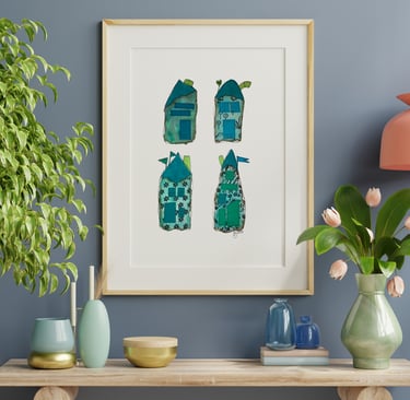 a picture of four whimiscal houses and a vase with flowers along with vases on a table