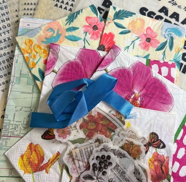 A collection of papers, napkins, transfers, letters, and ribbon