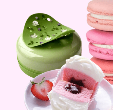 Student practicing pastry techniques with fresh baked goods in a professional kitchen