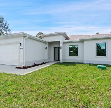Beautifully designed front elevation of a new home for sale in Lehigh Acres, Florida.