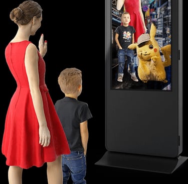 a woman and a boy watching a pokemon movie